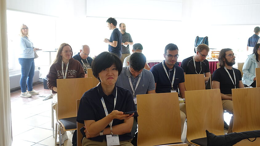 The photo shows some of the workshop participants during a coffee break.